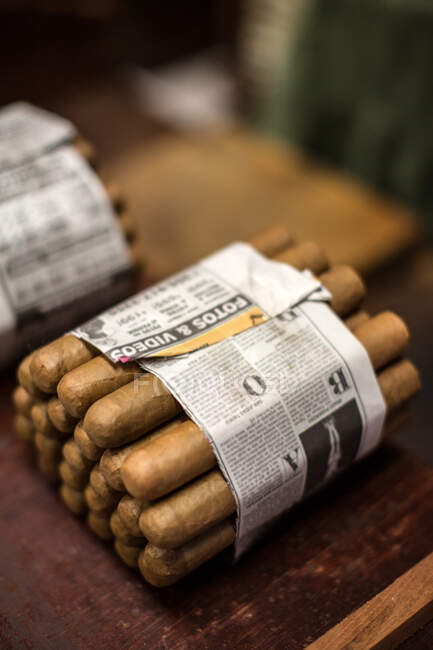 High angle view of cigars wrapped in newspaper, Little Havana — Stock Photo