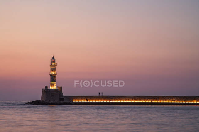 Silhouetted harbor walls of Chania after sunset, Crete, Greece — Stock Photo