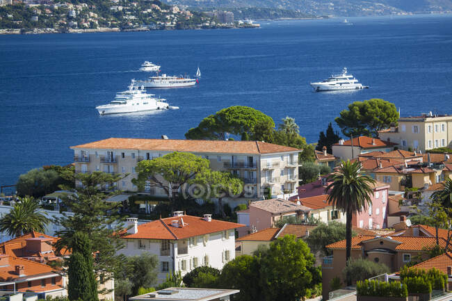 Elevated view of rooftops and coast, St Jean Cap Ferrat, France — Stock Photo
