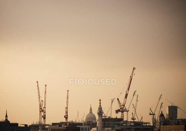 Skyline with construction cranes and St Paul cathedral, London, UK — Stock Photo