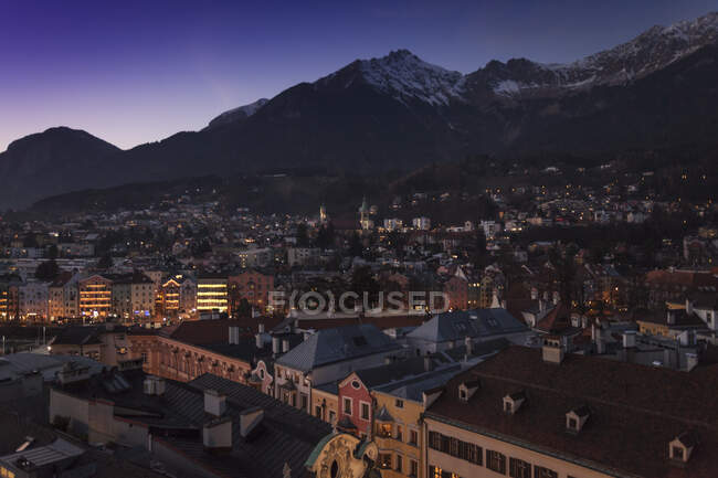 Elevated cityscape with distant illuminated christmas market str — Stock Photo