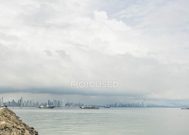 Distant view of ships and Panama city from waterfront, Panama — Stock Photo