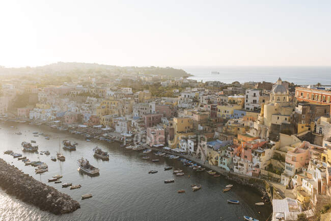 Elevated view of waterfront and buildings at dusk, Procida islan — Stock Photo