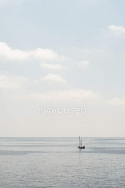 Sailboat anchored in calm sea — Stock Photo