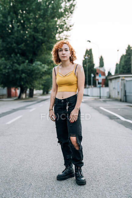 Portrait of young woman standing in street — Stock Photo