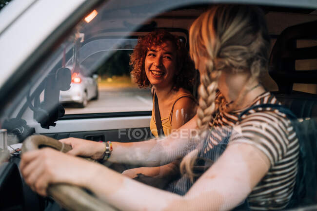 Happy female couple in van — Stock Photo