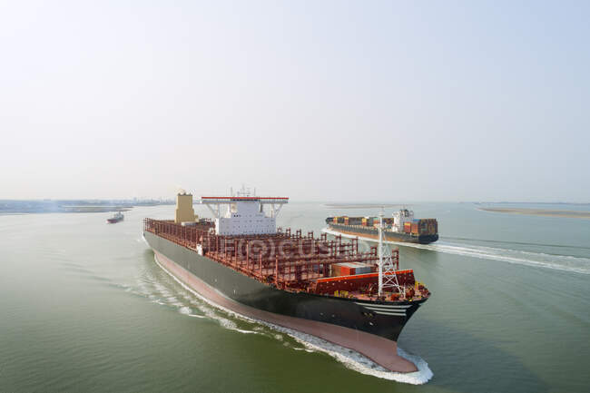 A 400m long container ship sails to the port of Antwerp, passing — Stock Photo