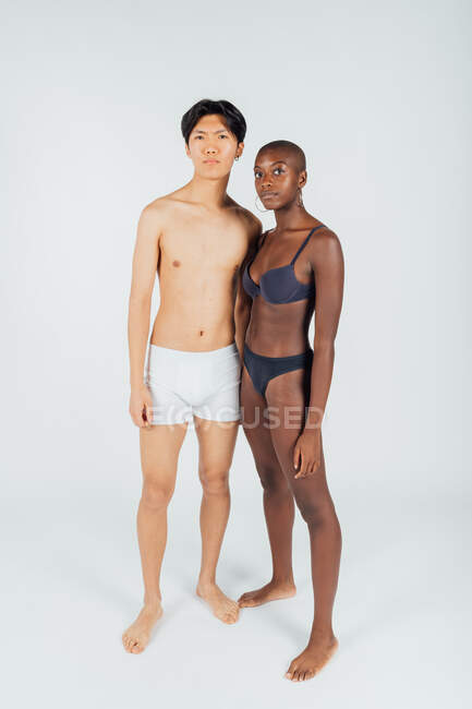 Young couple wearing underwear, full length — Stock Photo