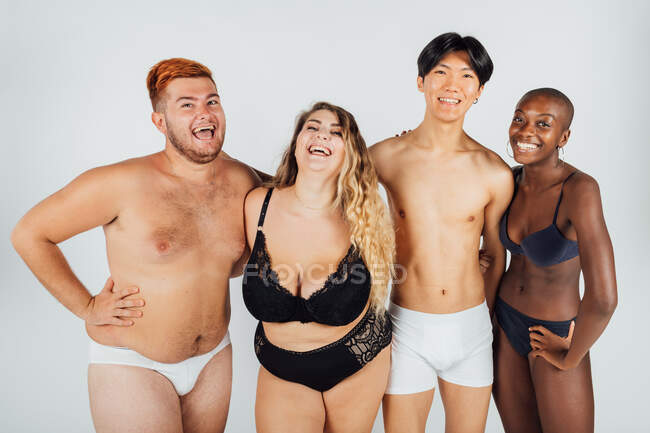 Friends laughing, wearing underwear — Stock Photo