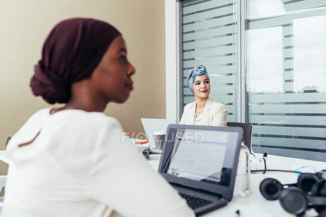 Female colleagues in office — Stock Photo
