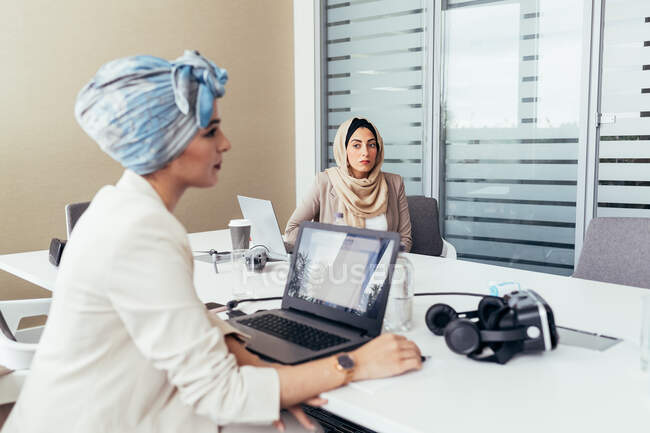 Female colleagues working in office — Stock Photo