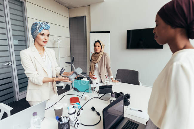 Businesswomen discussing drone in office — Stock Photo