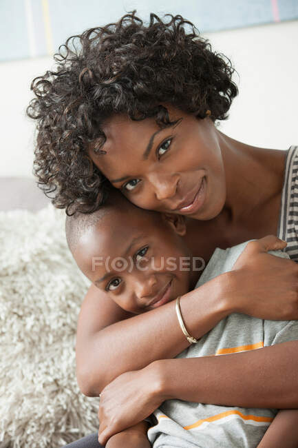 Portrait of mother hugging son — Stock Photo