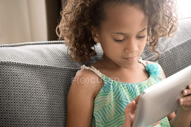 Girl using digital tablet — Stock Photo