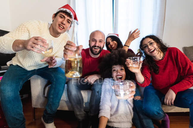 Friends raising a toast with drinks, video call view — Stock Photo