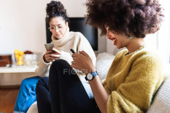 Friends looking at their phones — Stock Photo