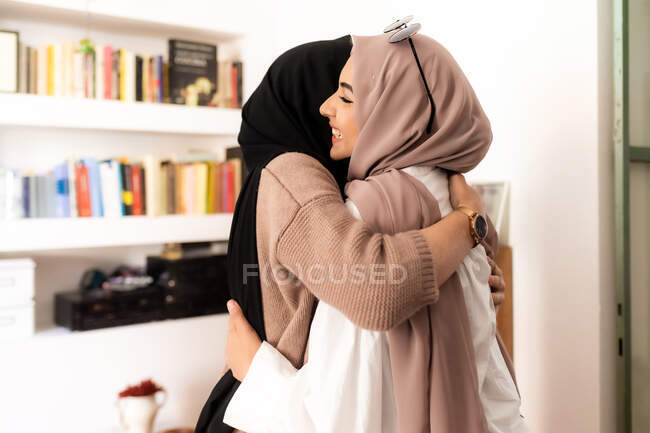 Female friends hugging, close-up view — Stock Photo