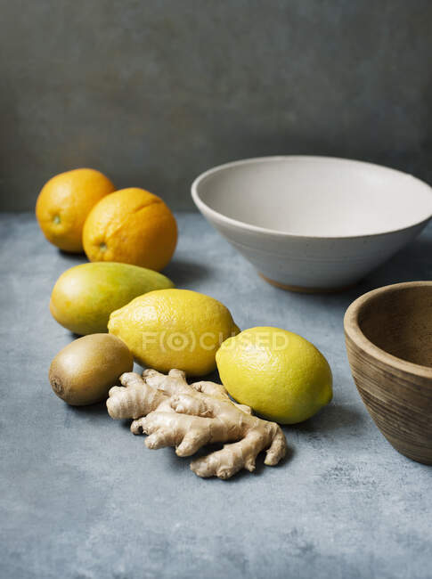 Citrus fruits with ginger root — Stock Photo