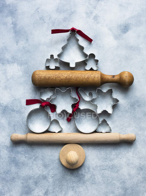 Cookie cutters with rolling pin in Christmas tree shape — Stock Photo