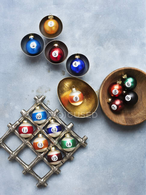 Christmas ornaments in gold, wood and silver bowls — Stock Photo