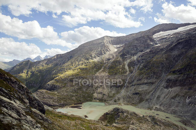 Italy, Austria, Lake in mountain landscape — Stock Photo
