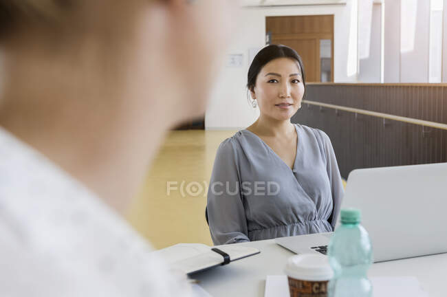 Germany, Bavaria, Munich, Businesswoman during meeting in office — Stock Photo