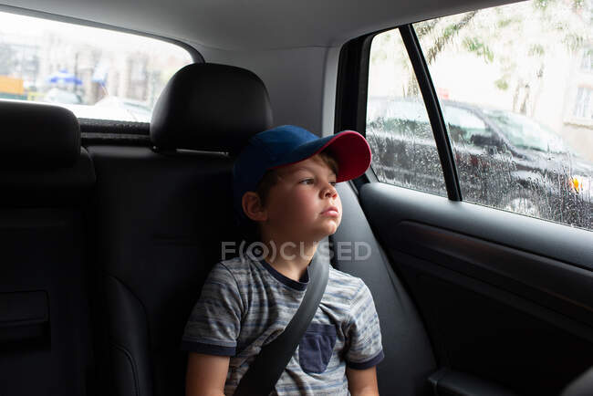 Canada, Ontario, Boy sitting in car — Stock Photo