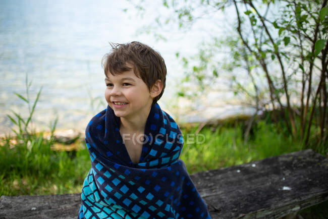 Canada, Ontario, Boy wrapped in towel — Stock Photo