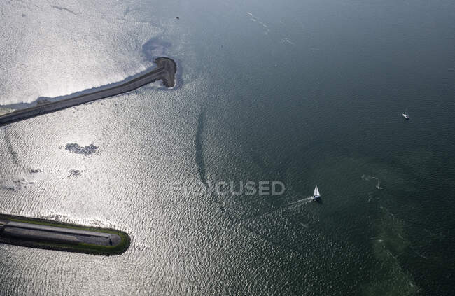 Netherlands, Zeeland, Zierikzee, Aerial view of sailboat at sea — Stock Photo
