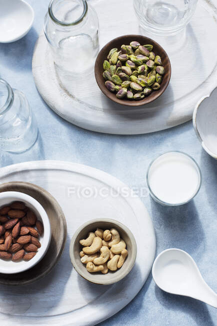 Overhead view of bowls with nuts on table — Stock Photo