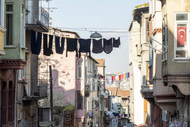 Turkey, Istanbul, Laundry drying between houses in Balat district — Stock Photo
