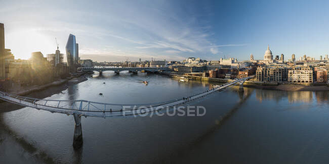 UK, London, High angle view ofMillennium Bridge over River Thames at sunset — Stock Photo