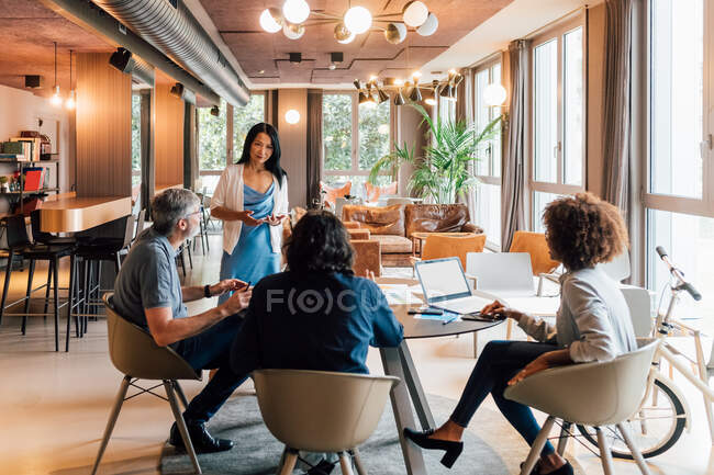 Italy, Business people having meeting in creative studio — Stock Photo