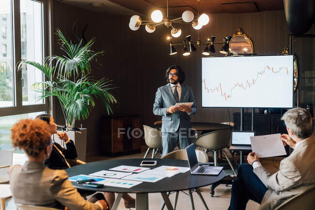Italy, Businessman having presentation in creative studio — Stock Photo