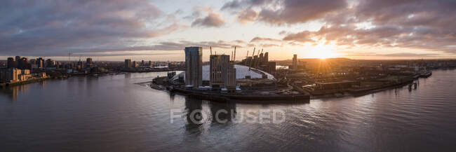 UK, London, Aerial view of The O2 and Docklands at awn — стокове фото