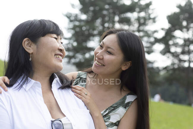 Germany, Freiburg, Smiling mother and adult daughter outdoors — Stock Photo