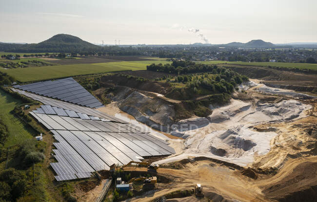 Germany, Herzogenrath, Aerial view of solar panels at sand mine — Stock Photo