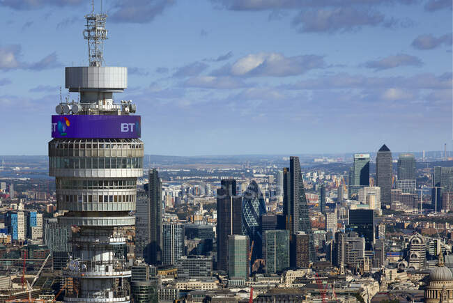 UK, London, City of London skyscrapers with BT Tower in foreground — Stock Photo