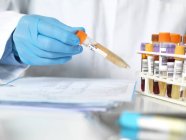 Cropped view of scientist holding sample for analytical testing. — Stock Photo