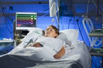 Intensive care child patient in bed. — Stock Photo