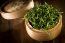 Close-up view of Samphire plants in bamboo steamer. — Stock Photo