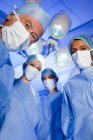Portrait of surgical team in face masks. — Stock Photo