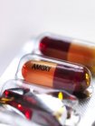 Amoxicillin antibiotic drug capsules, close-up. — Stock Photo