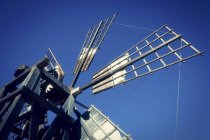 Windmill sails against blue sky. — Stock Photo