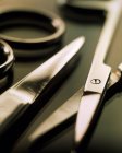 Close-up of pairs of scissors on table. — Stock Photo