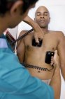 Doctor administering emergency defibrillation to patient. — Stock Photo