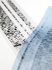 Close-up of DNA autoradiograms on white background. — Stock Photo