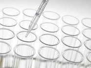 Graduated pipette and test tubes — Stock Photo