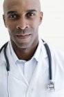 Portrait of cheerful male doctor with stethoscope. — Stock Photo