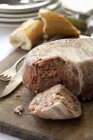 Chicken, pork and duck terrine on table — Stock Photo